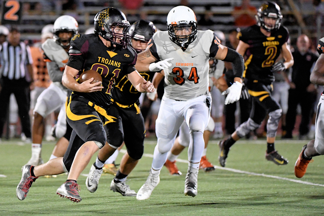 Peter Davis / Special to the Pahrump Valley Times
Case Murphy carries the ball on Friday against Chaparral. Murphy has four TDS this year. Murphy also got an interception that ended it for the Cow ...