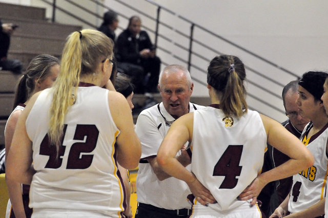 Coach Bob Hopkins discusses tactics with his team during a timeout.
Horace Langford Jr. / Pahrump Valley Times