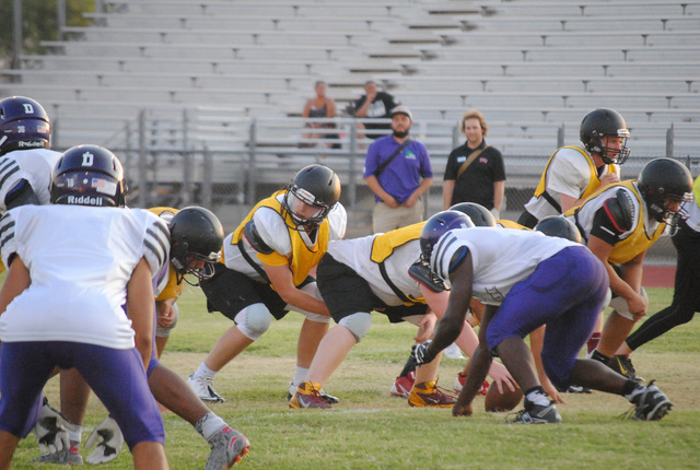 Charlotte Uyeno / Pahrump Valley Times
Parker Hart gets ready to take a snap during the Trojans scrimmage with Durango High School.