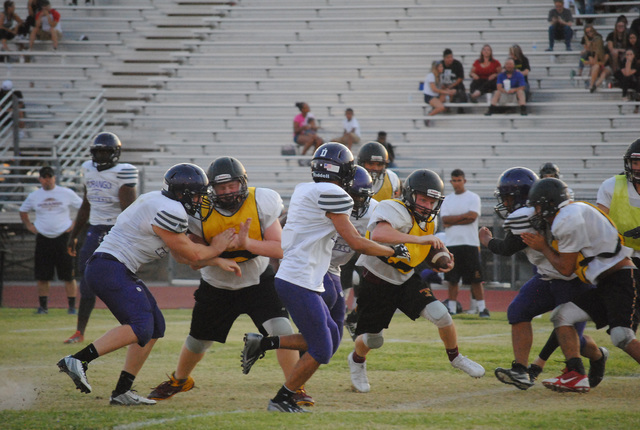 Charlotte Uyeno / Pahrump Valley Times
The Trojans run the ball against Durango. Joe Clayton will bring back the running game to Pahrump with his jett sweep offense.