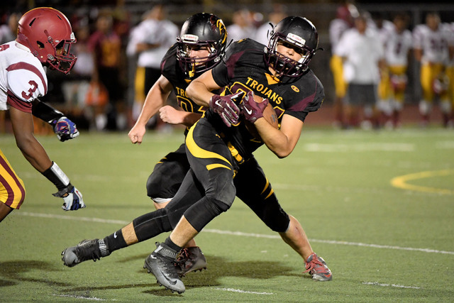 Peter Davis / Special to the Pahrump Valley Times 

Nico Velasquez finds a hole to run through at the Del Sol game. He currently has four touchdowns and is tied with Case Murphy for the team lead.