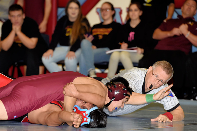 Junior Ulisses Perez (138 pounds) takes his Western opponent to the ground in last week’s victory over Western and Sunrise Mountain. At the end of the day, the Trojans had their first two confer ...