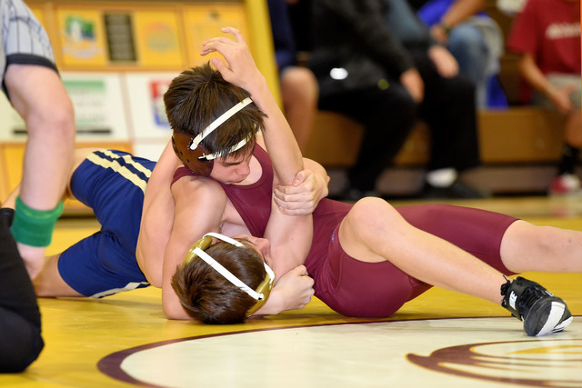 Freshman Wyatt Platt (113 pounds) gets a pin against Cheyenne on Wednesday night. 
Peter Davis / Special to the Pahrump Valley Times