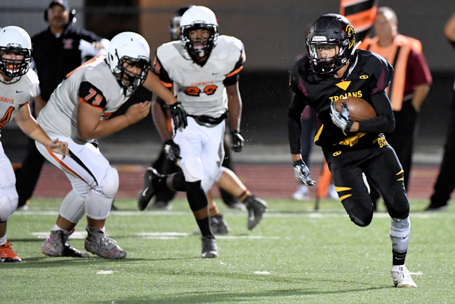 Peter Davis / Special to the Pahrump Valley Times
Jacob Sawin carries the ball last Friday in Pahrump against the Cowboys.