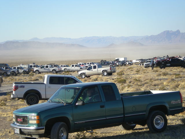 Support vehicles and fans gather at the first pit stop for the Pahrump 250 on Dec. 3 nearly 15 miles outside of Pahrump. The event attracted close to 150 racers this year, selling out hotel rooms  ...