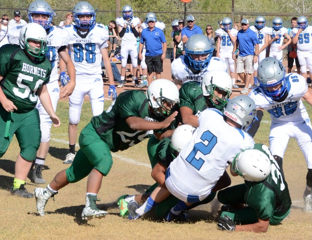 Richard Stephens / Pahrump Valley Times
Richard Stephens / Pahrump Valley Times 

A swarm of Hornets tackles an Alamo runner in last year’s contest between Beatty and Pahranagat Valley. The Pant ...