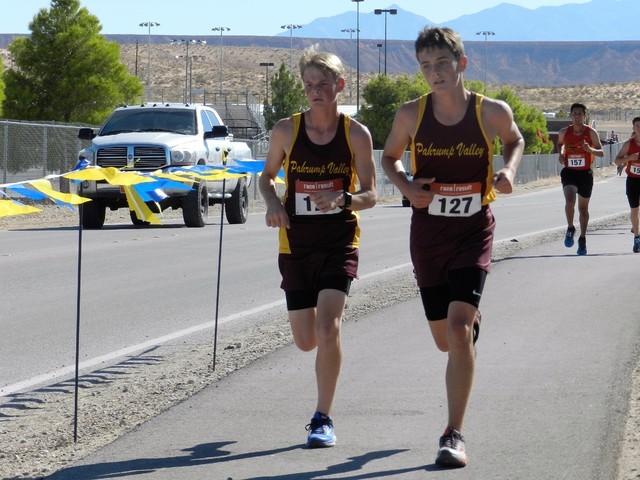 Special to the Pahrump Valley Times
Grant Odegard, on the left, running with Michael Sonerholm at the Moapa Valley Invitational.