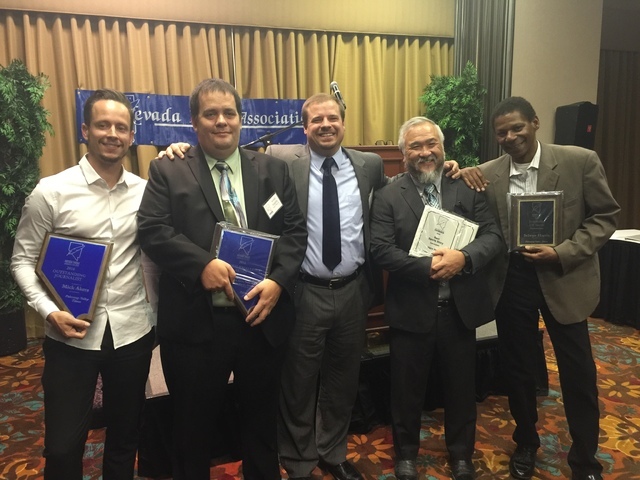 Pahrump Valley Times reporter Mick Akers (from left), editor Arnold Knightly, publisher Noah Cusick, sports writer Vern Hee and reporter Selwyn Harris display some of the 10 awards the paper took  ...