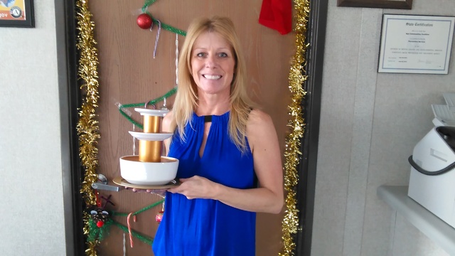 Selwyn Harris/Pahrump Valley Times Dianna Carrell, Fiscal Administrative Assistant for NyE Communities Coalition holds aloft the coveted Chocolate Buffet trophy. The organization invited community ...