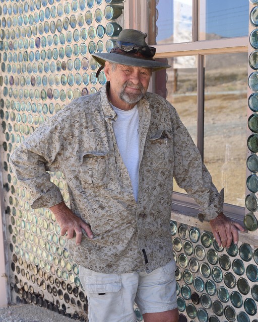 Special to the Pahrump Valley Times
Karl Olson, the organizer of the Beatty VFW Turkey Shoot, stands next to the bottle house in Rhyolite. All benefits from the shoot go to the Beatty VFW communit ...