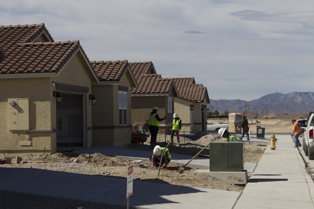 Workers finish homes at the Burson Ranch community by Beazer Homes, Thursday, Feb. 16, 2017, in Pahrump, Nev. (Erik Verduzco/Las Vegas Review-Journal) @Erik_Verduzco