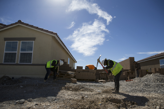 Workers finish homes at the Burson Ranch community by Beazer Homes, Thursday, Feb. 16, 2017, in Pahrump, Nev. (Erik Verduzco/Las Vegas Review-Journal) @Erik_Verduzco