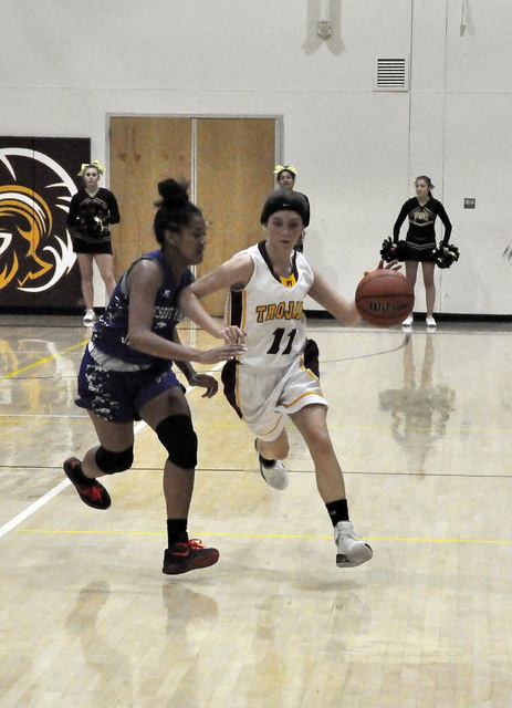 Bethany Calvert drives the ball down the court, looking for someone to pass to. The Trojans lost to Desert Pines 41-25.
Horace Langford Jr. / Pahrump Valley Times
