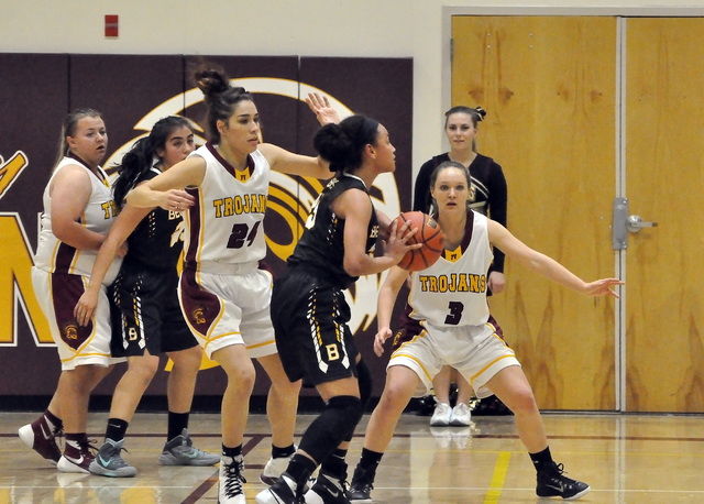 Horace Langford Jr. / Pahrump Valley Times 

Helen Vann (24) and Jackie Stobbe (3) seal off the basket from Bonanza. The Trojans defense allowed only 5 points in the first half and was the main re ...