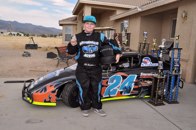 RJ Smotherman, a local eleven-year-old racer, stands in front of his race trophies. He wants to be a NASCAR driver someday.
Horace Langford Jr. / Pahrump Valley Times