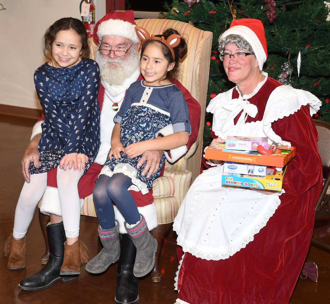 Richard Stephens/Special to the Pahrump Valley Times
Mr. and Mrs. Claus made their traditional entrance riding on a fire engine on Dec. 15 in Beatty. They then greeted children individually at the ...