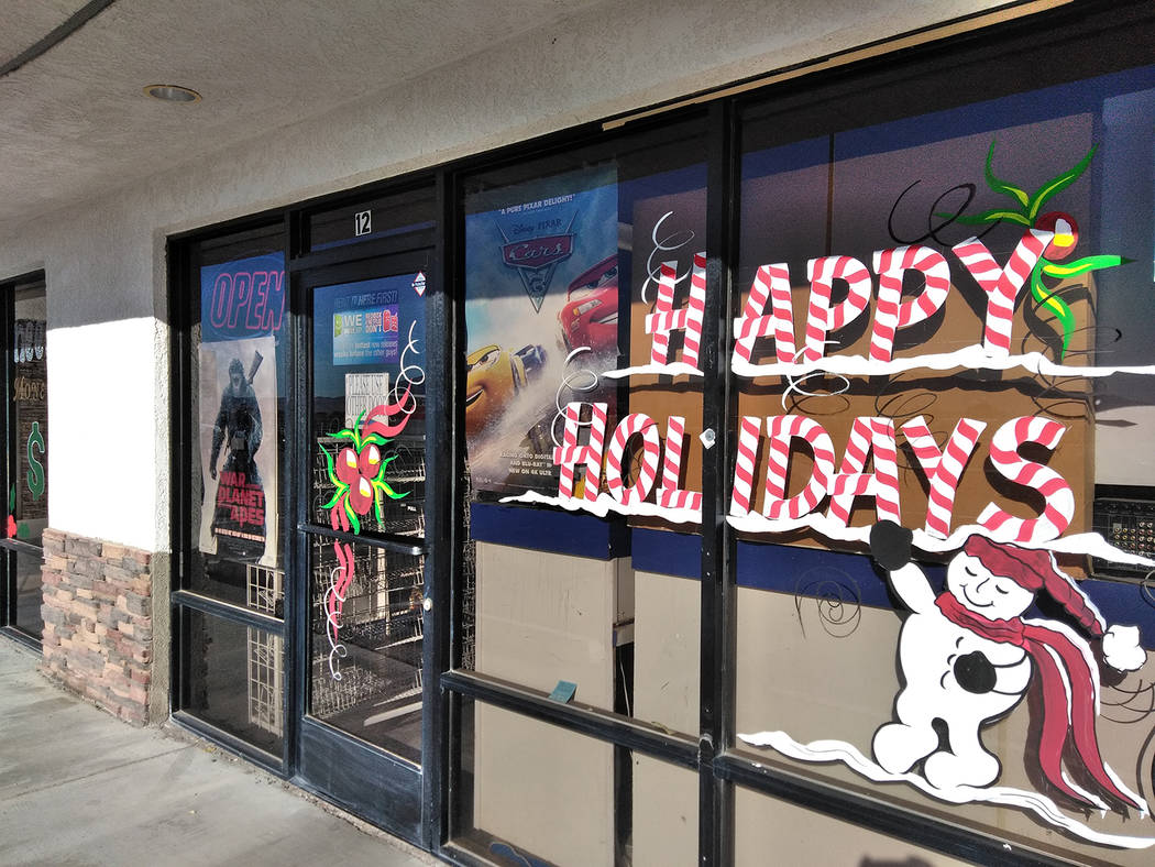 Selwyn Harris/Pahrump Valley Times 
The holiday artwork of Douglas “Dok” Hembree can be found on many area retailers around the Pahrump Valley, including the Star Lite Video location along Hig ...