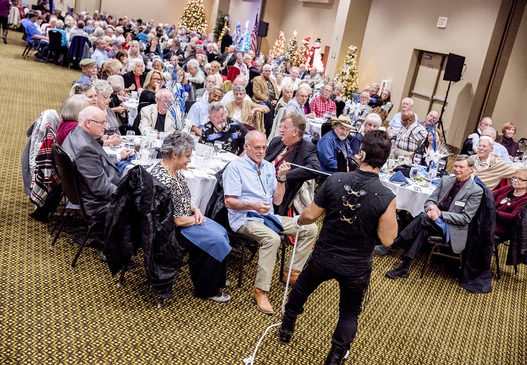 Special to the Pahrump Valley Times
Entertainer and magician, Olly, entertains the crowd of more than 200 ambassadors at the 2017 Ambassador Christmas dinner and awards banquet at the Pahrump Nugg ...