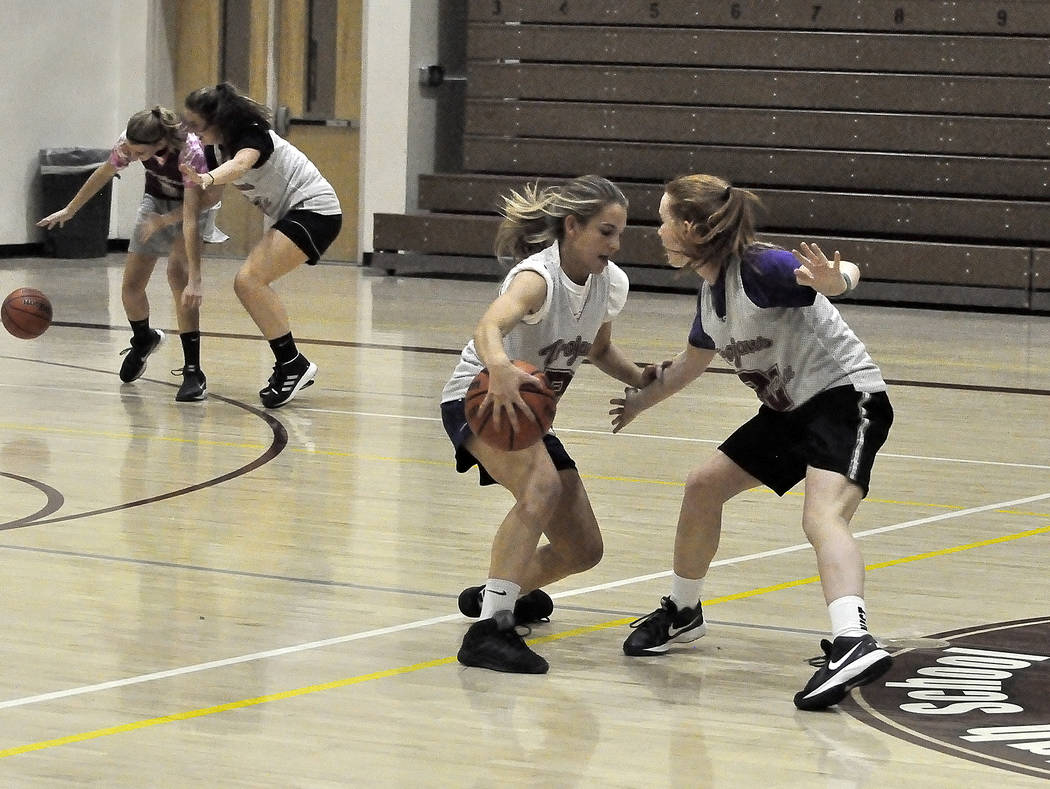 Horace Langford Jr./Pahrump Valley Times
Samantha Runnion and Makayla Gent of the girls basketball team at Pahrump Valley High School are seen practicing earlier this season.The Lady Trojans next  ...