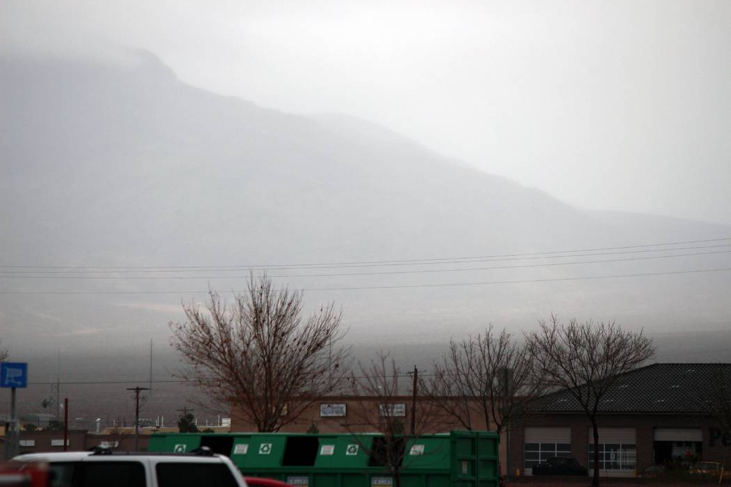 Jeffrey Meehan/Pahrump Valley Times
Clouds set in across the mountain landscape to the north of the Pahrump Walmart on Jan. 9, 2017. Measurable rainfall hadn't landed in the valley for 116 days, b ...