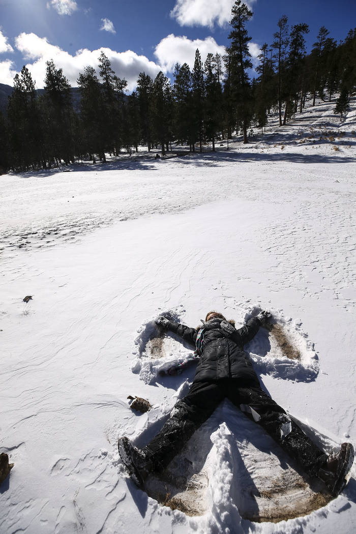 Richard Brian/Las Vegas Review-Journal 
Jenna Leinecke, 11, of Indian Springs makes a snow angel while playing with her family at Lee Canyon's Upper Meadow on Mount Charleston on Thursday, Dec. 21 ...