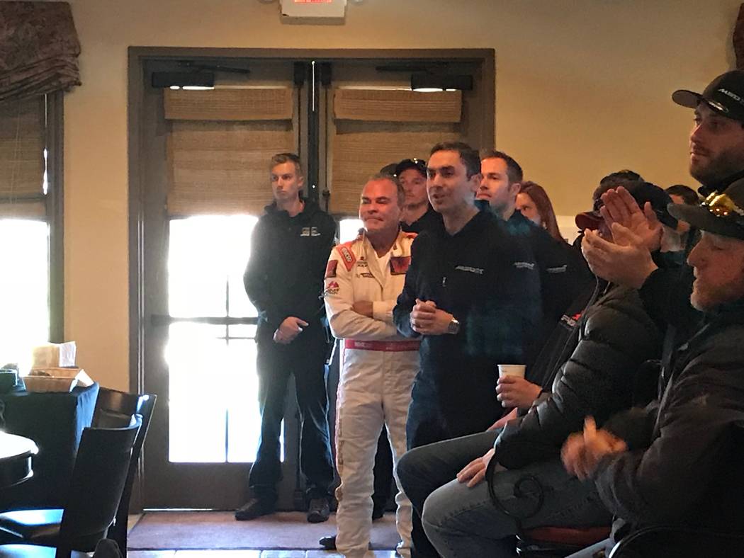 Jeffrey Meehan/Pahrump Valley Times
Spring Mountain Motor Resort and Country Club owner John Morris stands with team members from British supercar maker McLaren and others inside the clubhouse of  ...