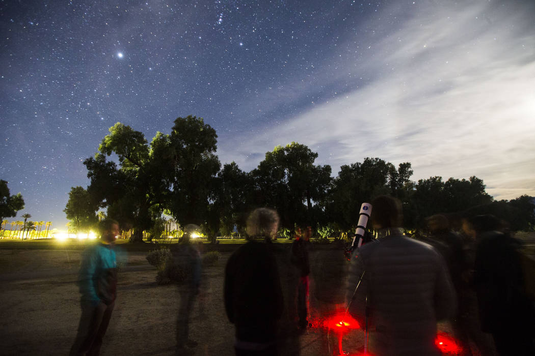 People participate in a stargazing activity led by Greg McKay of the Las Vegas Astronomical Society at the Furnace Creek Golf Course at the Oasis at Death Valley in Death Valley National Park, Cal ...