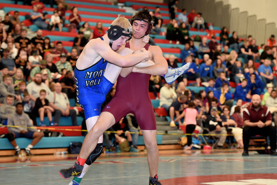 Peter Davis/Special to the Pahrump Valley Times
Dylan Grossell, at 138 pounds and in the maroon uniform, is shown competing in the regional wrestling championship this past week. He is advancing t ...