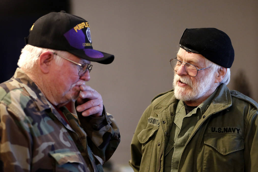 Veterans Bob Haygood, left, and Dean Johnson exchange war stories during a 50th anniversary event remembering the Vietnam War Tet Offensive at the American Legion Vegas Post 8 in Las Vegas, Saturd ...