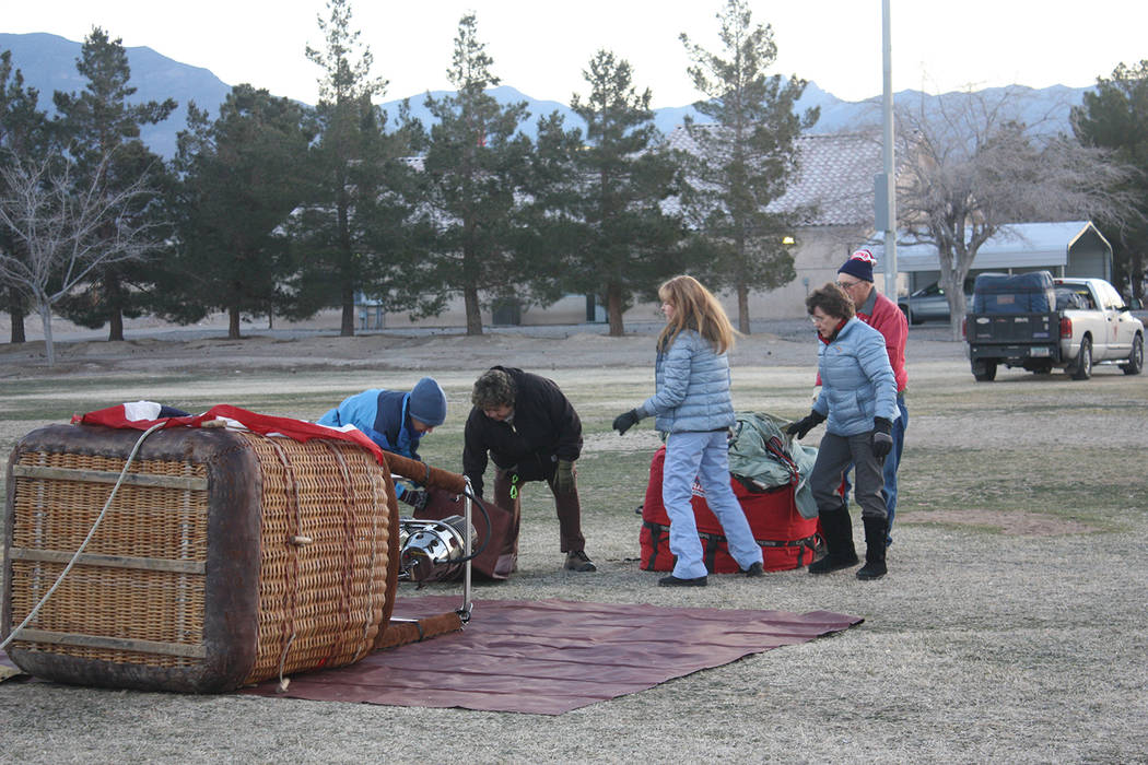 Robin Hebrock/Pahrump Valley Times
Members of the Rainbow Thru Heaven hot air balloon team prepare for launch during the Balloon Festival's media day.
