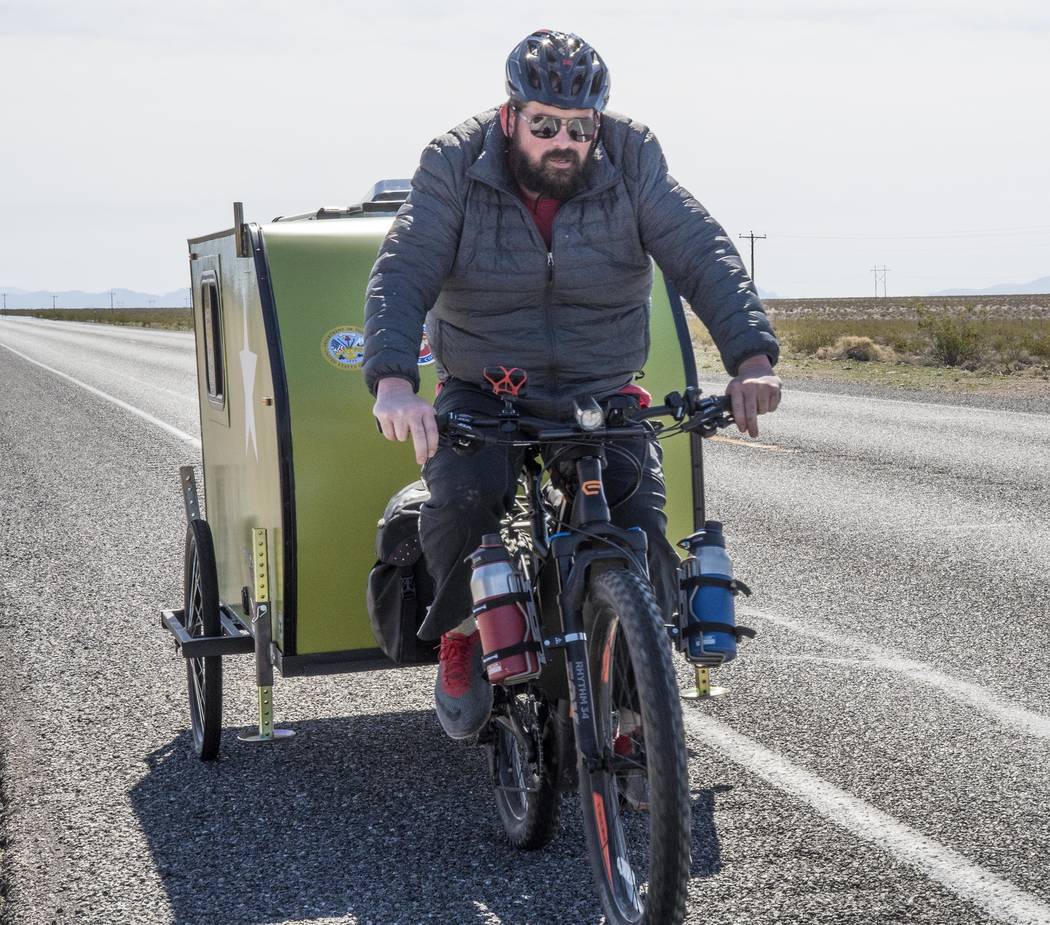 Richard Stephens/Special to the Pahrump Valley Times
Eli Smith pedaling between Lathrop Wells and Beatty before the hit-and-run crash. Smith, an Army veteran, is traveling the four corners of America.