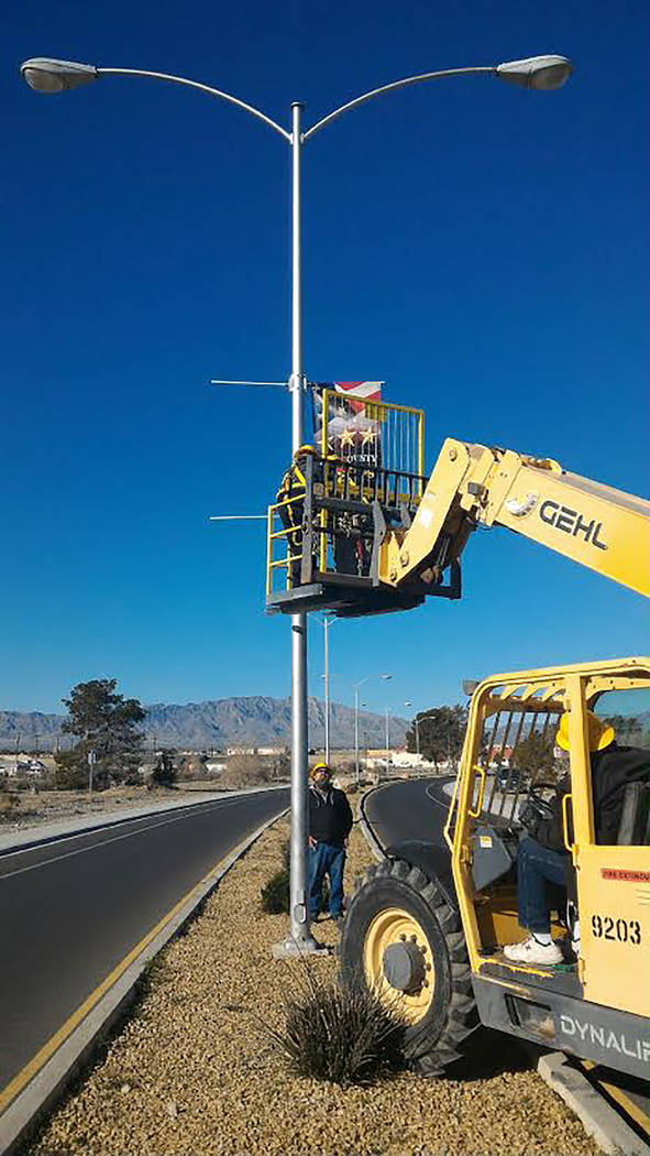 Special to the Pahrump Valley Times
Nye County employees and members of the American Veterans Foundation of Pahrump were out on March 27 to hang the first round of banners in the Nye County Vetera ...