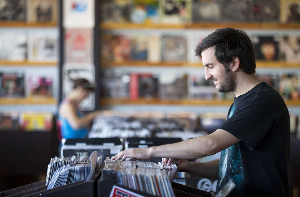 Richard Brian/Las Vegas Review-Journal 
Las Vegas resident Taylor Blake browses the vinyl records at 11th Street Records on Small Business Saturday, Nov. 25, 2017, in downtown Las Vegas.