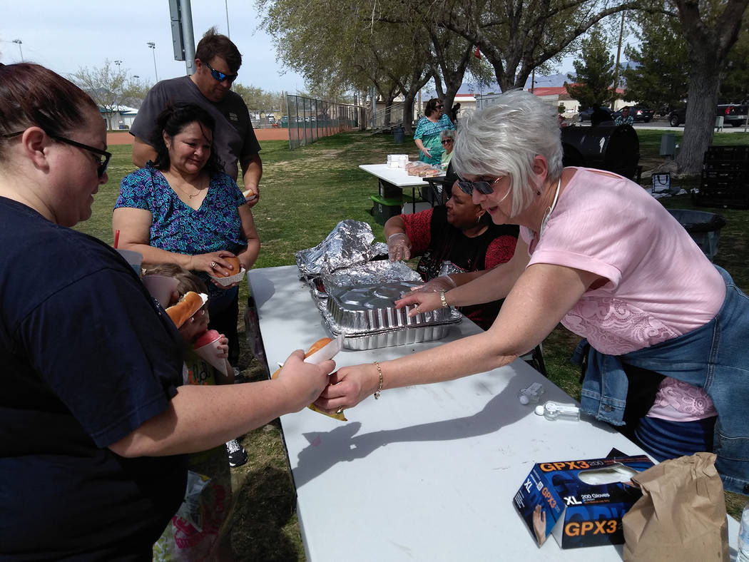 Selwyn Harris/Pahrump Valley Times
More than 1,200 hamburgers were grilled up and served up, courtesy of volunteers from NyE Community Coalition's Holiday Task Force. Organizers thanked the numero ...