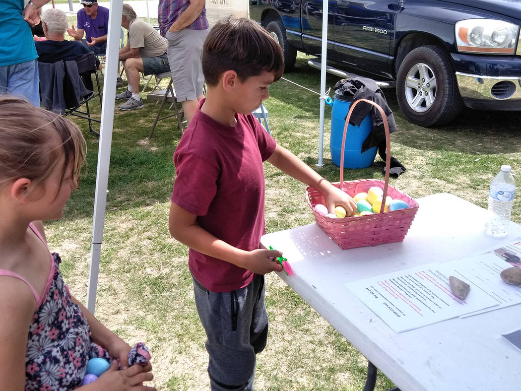 Selwyn Harris/Pahrump Valley Times
Abandoning the traditional Easter Egg Hunt, organizers opted for an "Egg Scramble," where kids would visit the various booths in the park to collect their colorf ...