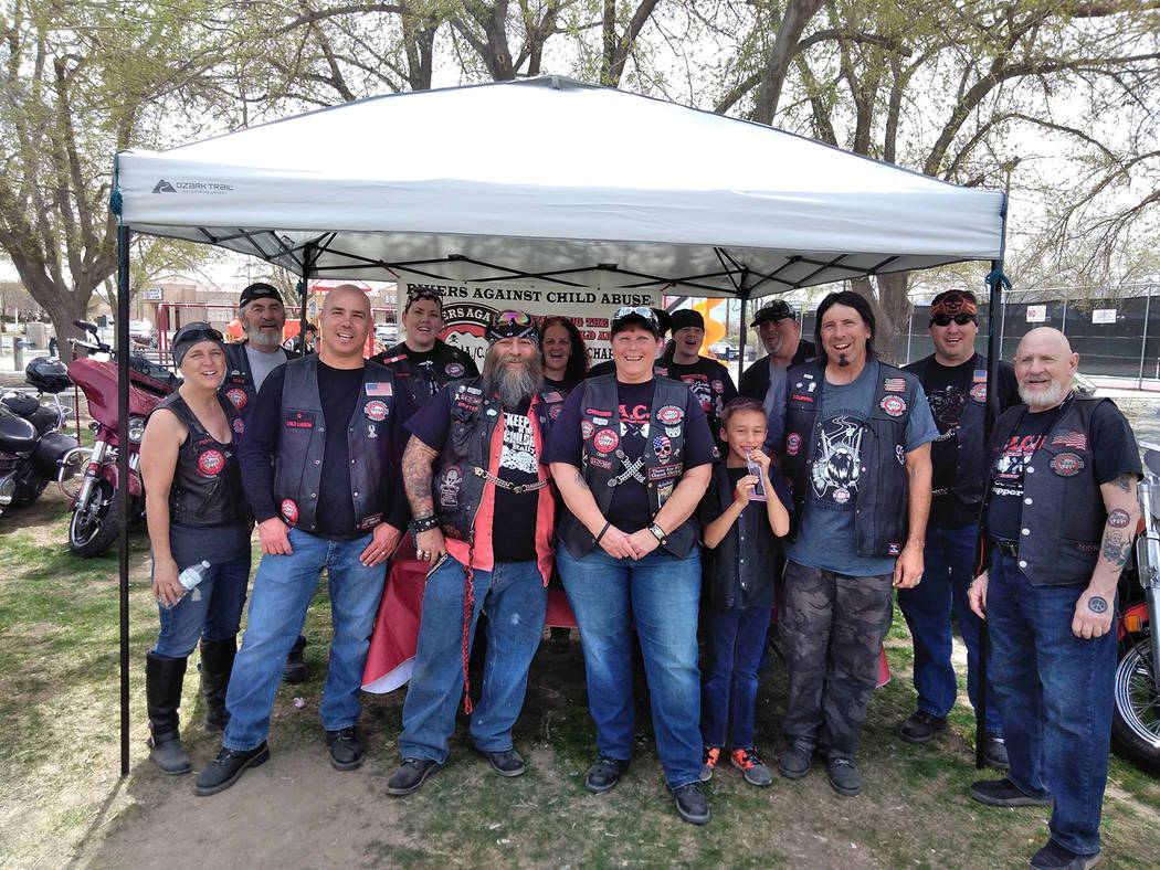 Selwyn Harris/Pahrump Valley Times
The booth consisting of members from Bikers Against Child Abuse, or "BACA," was a very popular attraction at the Easter Day picnic.  “Chrome,” front and cent ...
