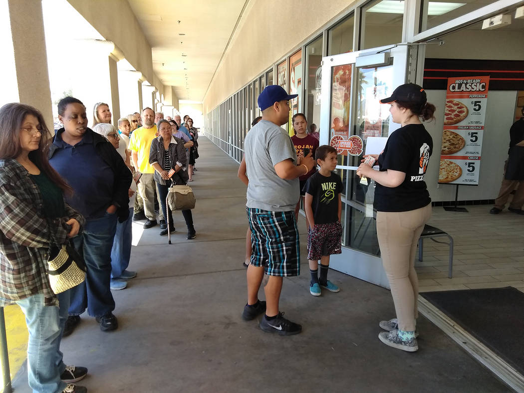 Selwyn Harris/Pahrump Valley Times
Customers began lining up for free lunch courtesy of Pahrump's Little Caesars Pizza in the Albertsons Plaza. Beginning at 11:30 a.m., customers began received th ...
