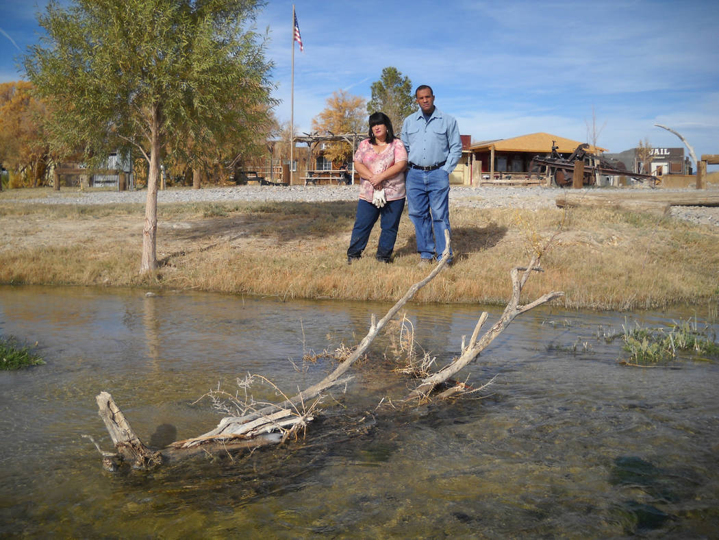 Pahrump Valley Times Victor and Annette Fuentes stand in front of a flooded approach to their church camp in this 2007 file photo. The property has dramatically changed since then, due to U.S. Fi ...