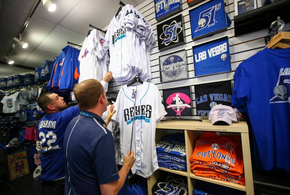 Fans browse team merchandise during the Big League Weekend baseball game  between the Chicago Cubs and the New York Mets at Cashman Field on Friday,  March 1, 2016, in Las Vegas. The