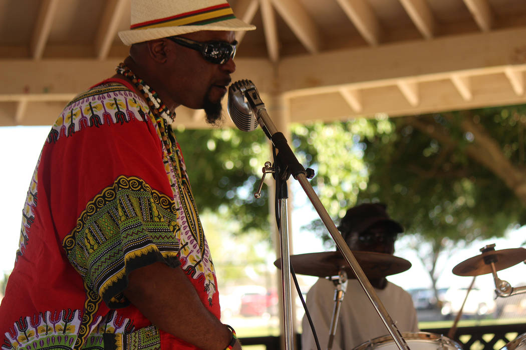 Jeffrey Meehan/Pahrump Valley Times A performer sings reggae-style music at Ian Deutch Memorial Park on May 12, 2018. The sounds of music that found its origins in Jamaica in the late 1960s pulsed ...