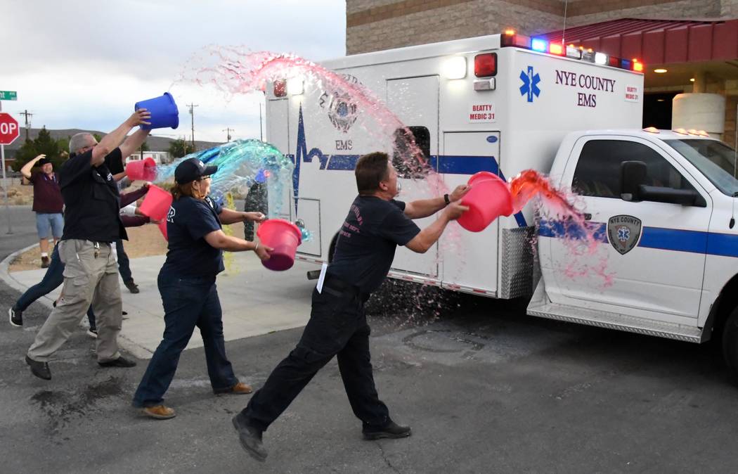 Richard Stephens/Special to the Pahrump Valley Times Members of the community, including emergency service volunteers, participate in a "washing down" ceremony for the new ambulance.