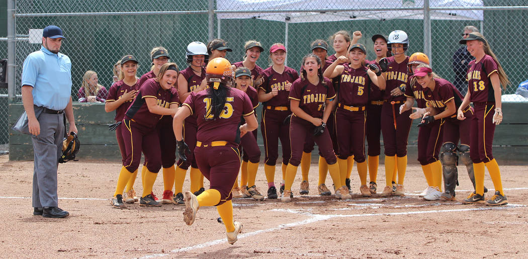 Steve Ranson/Special to the Pahrump Valley Times Taylor Egan (15) gets an enthusiastic welcome at home plate after her first-inning home run gave Pahrump Valley a 2-0 lead over Churchill County in ...