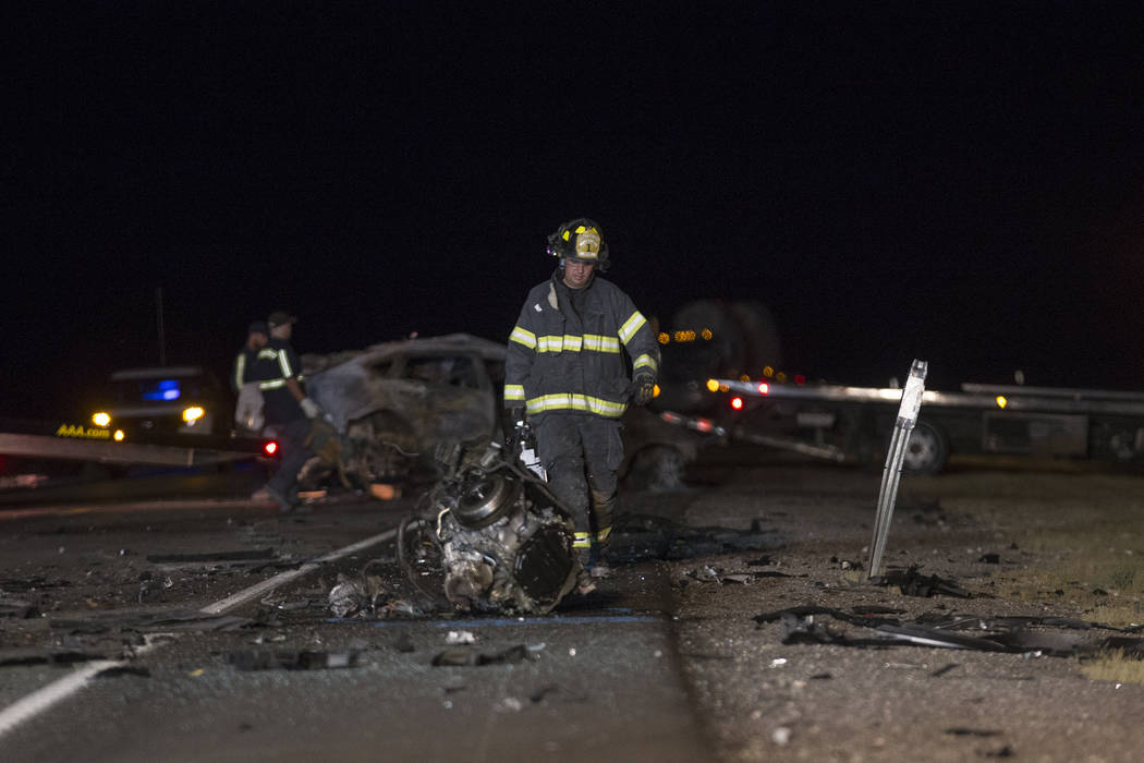 Workers at the scene of the multi-fatality crash on U.S. Highway 95, near Amargosa Valley in Nye County, Sunday, May 20, 2018. (Rachel Aston Las Vegas Review-Journal @rookie__rae)