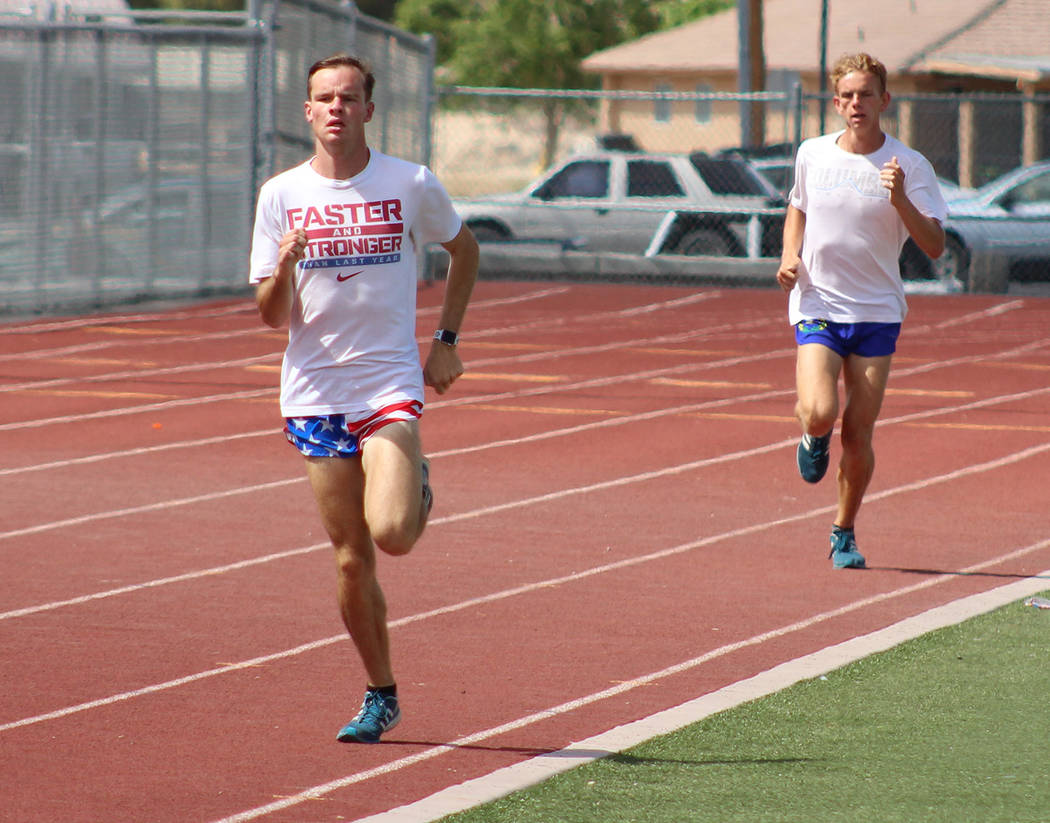Tom Rysinski/Pahrump Valley Times Seniors Bryce Odegard, left, and Layron Sonerholm work out on the track May 14 at Pahrump Valley High School in preparation for the Class 3A state meet in Carson ...