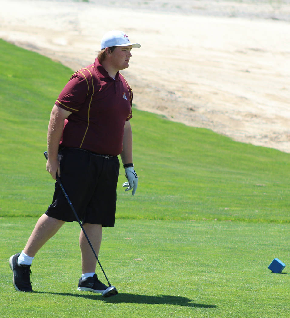 Tom Rysinski/Pahrump Valley Times Pahrump Valley senior Mike McDougall watches his shot off the first tee during the Class 3A state championships May 15 at Mountain Falls Golf Course in Pahrump.