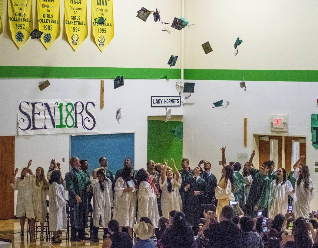 Richard Stephens/Special to the Pahrump Valley Times Students toss their graduation caps into the air as Beatty High School's graduation draws to a close on May 21. The class colors were turquoise ...