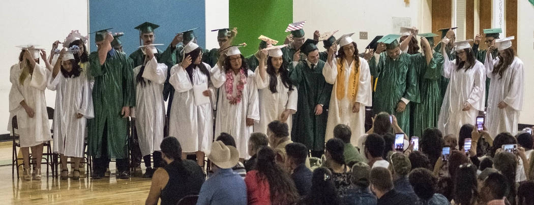 Richard Stephens/Special to the Pahrump Valley The students traditionally change their cap tassels from one side to the other after the class is presented. This year's Beatty High School graduati ...