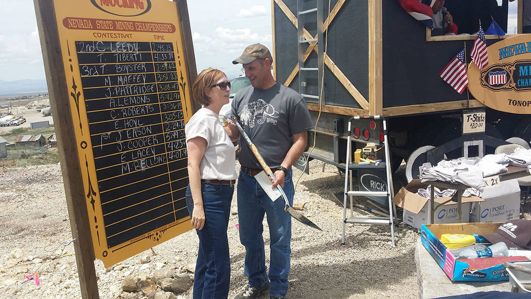 Dana Bennett, president of the Nevada Mining Association, left, chats with former Tonopah Town Manager James Eason on May 28. Bennett presented Eason an award for winning a mucking competition at ...
