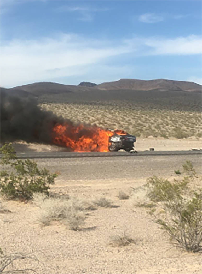 A vehicle is engulfed in flames in the multi-fatality crash on U.S. Highway 95, near Amargosa Valley in Nye County, Sunday, May 20, 2018. (Nevada Highway Patrol)