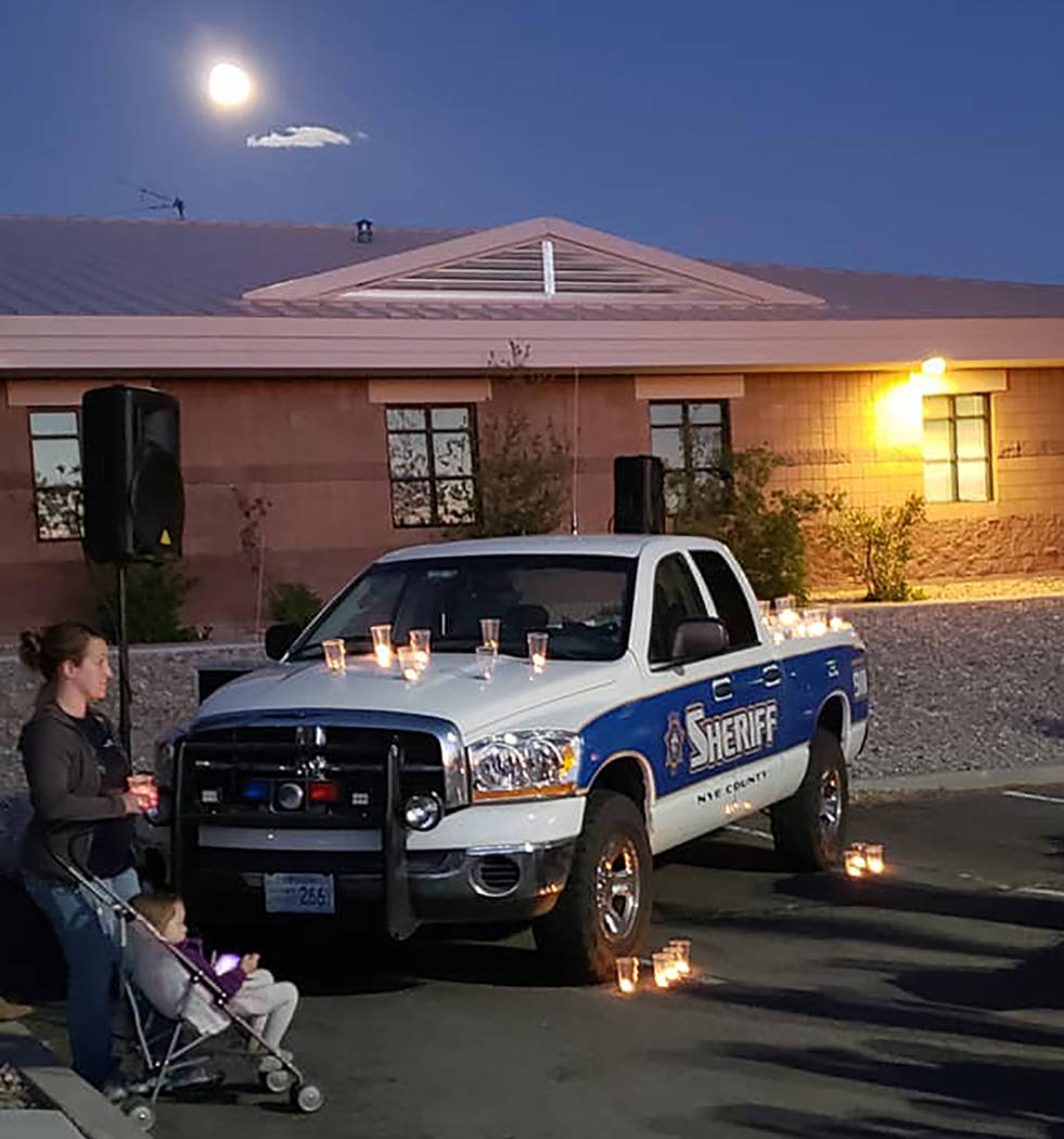 Esmeralda County Sheriff's Office Candles illuminate Nye County Sheriff's Sgt. Duane Downing's sheriff's pickup truck at a vigil held Monday, May 28 in the town of Tonopah. Downing was injured a w ...